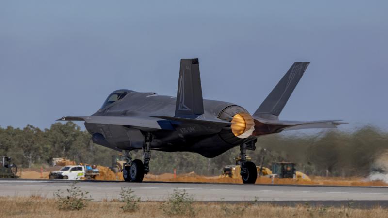 An F-35A Lightning II aircraft begins its takeoff down a runway.