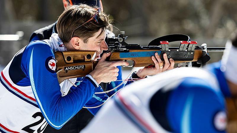 An aviator from the Air Force biathlon team fires his rifle during Exercise Coolshot.