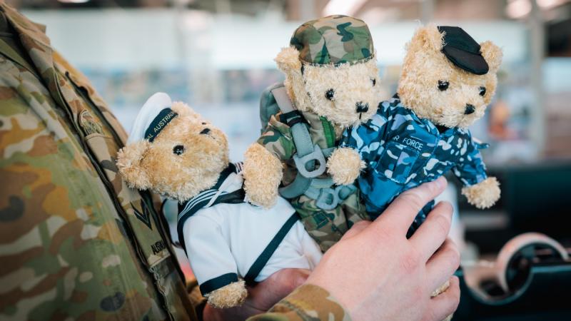 Three Legacy Bears wear Navy, Army and Air Force uniforms.