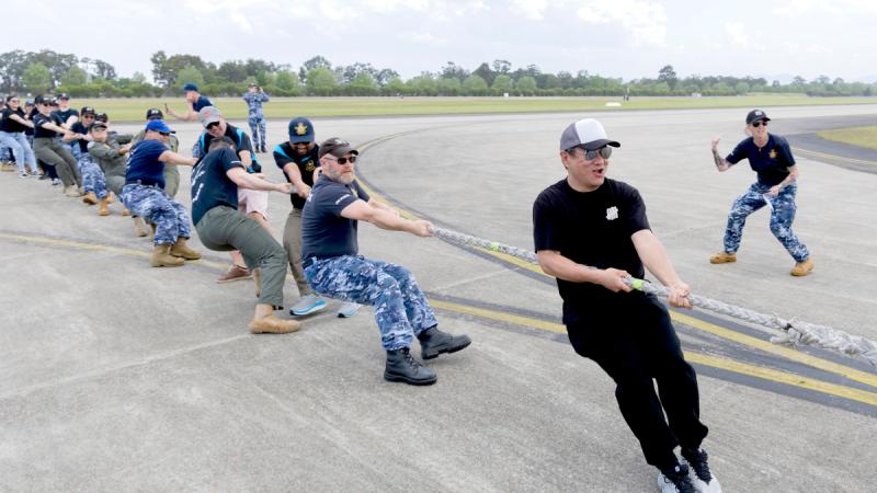 Royal Australian Air Force personnel participate in the Herc Haul Championship at the RAAF Richmond Air Show 2025. Photo by AC Jonathon McCaffrey.