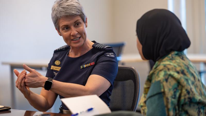 QAn Air Force officer speaks to her Brunei counterpart during regional engagement activities.