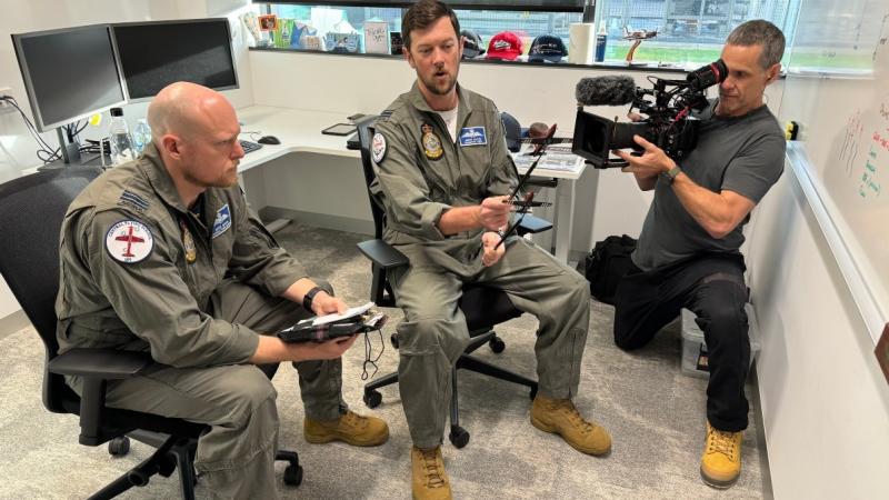 Two Air Force pilots discuss an aerobatics display on camera for 9Network.
