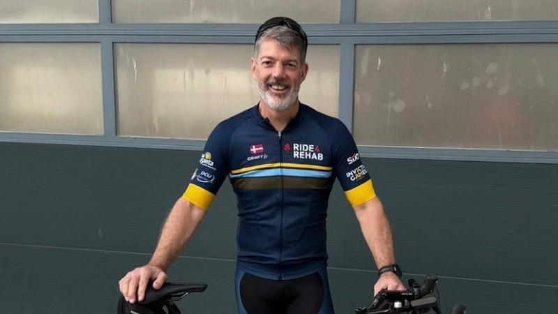 Air Force officer in cycling gear ready for a bike ride.