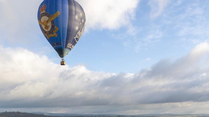 The Air Force Balloon flies quietly over the countryside before the 2025 Repco Bathurst 1000.