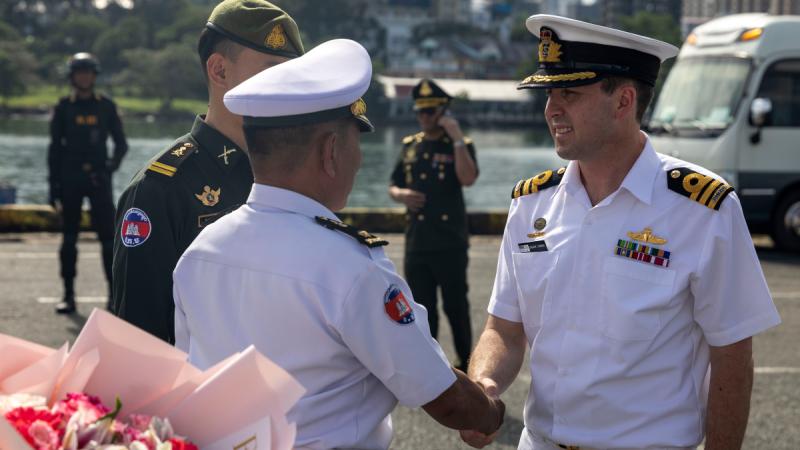 Two military officers shaking hands.