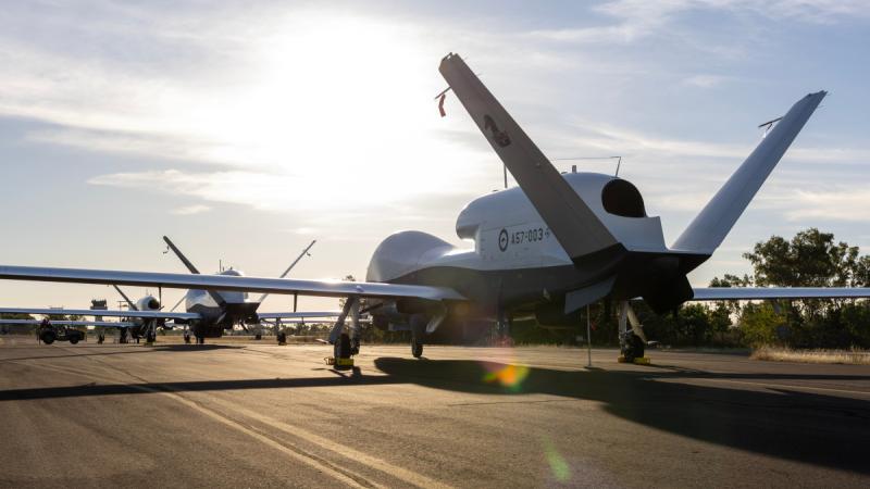 Three Royal Australian Air Force MQ-4C Triton aircraft on the taxiway at RAAF Base Tindal, NT.