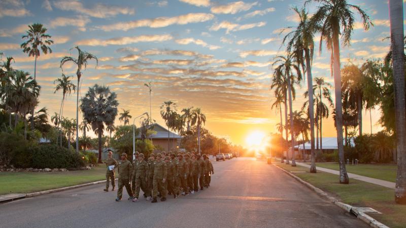 Military troops walking in formation.