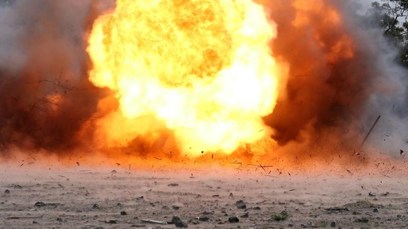 n F60 Bangalore torpedo explodes at a demolitions range.