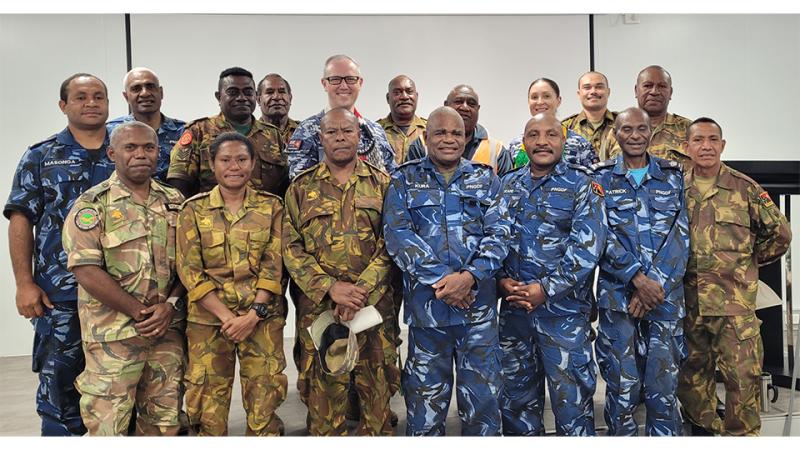 A group of men and women in military uniform.