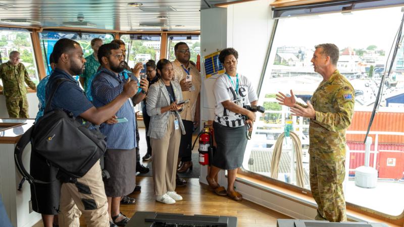 An Australian military officer addresses regional representatives on board an Australian vessel at Suva, Fiji.