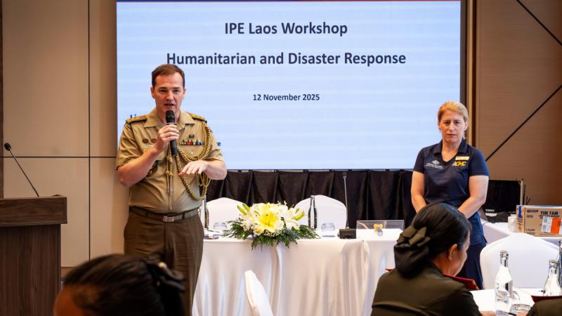 An Australian officer addresses an audience in Laos.