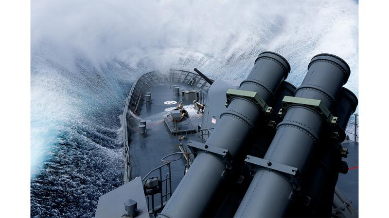 A ship nosedives into a large wave.