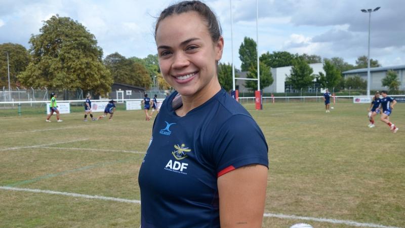 An Air Forced aviator relaxes after a championship match of the Women's International Defence Rugby Competition.