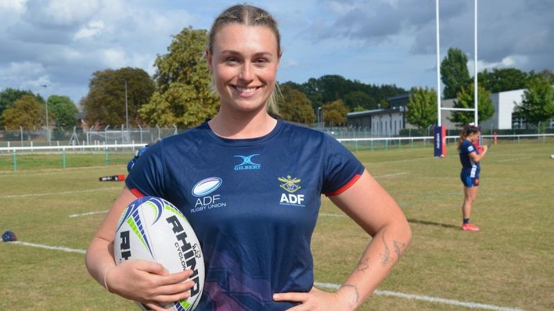An Australian Army soldier relaxes after a championship round of the Women's International Defence Rugby Competition in Aldershot, UK.