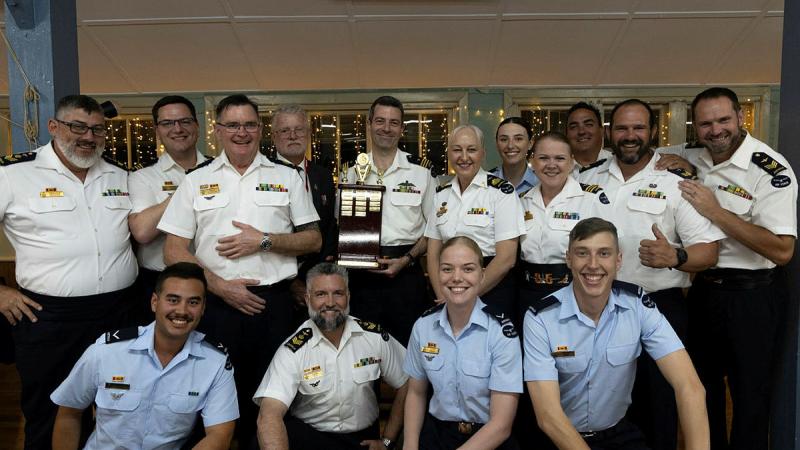 Pathfinder Association representative Jeff McClenaughan awards 35 Squadron the Squadron of the Year trophy during the 2025 Pathfinders Awards at RAAF Base Richmond.