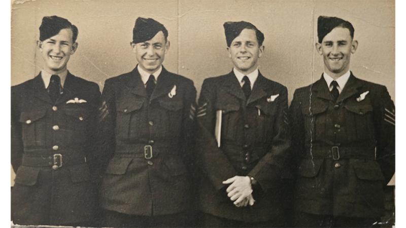 An old photo of four military men.