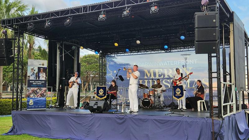 Members of the RAN Band Northern Territory play alongside two high school students at a 'be a part of magic' event in Darwin.