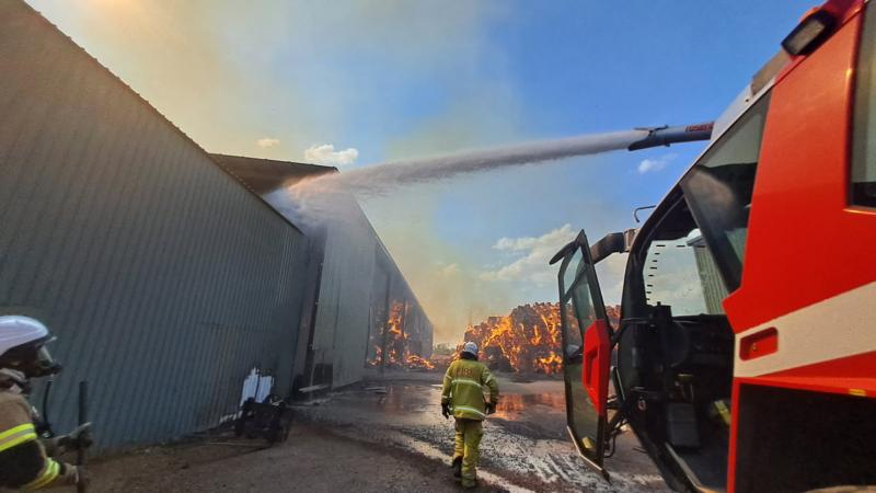 A 17 Squadron Panther Fire Truck roof-mounted water turret is used to contain a hay fire that was threatening a local business in Katherine, NT.