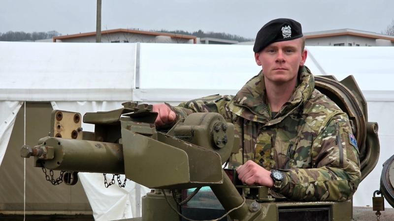 An Australian Army officer delivers an Abrams tank to Ukraine.