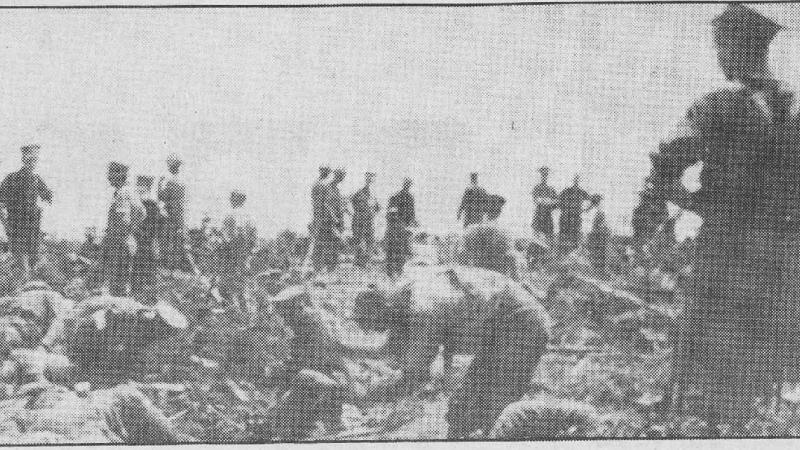 A black and white newspaper clipping of military personnel.