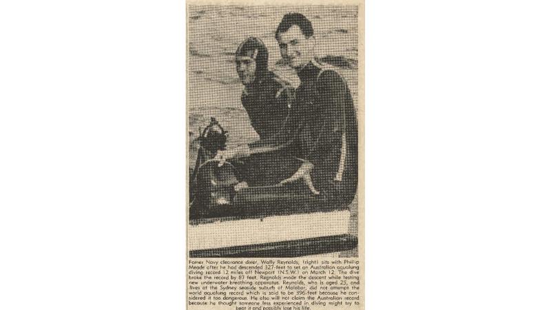 An old newspaper story shows two men sitting in a boat.