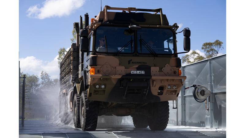 A military vehicle gets washed.