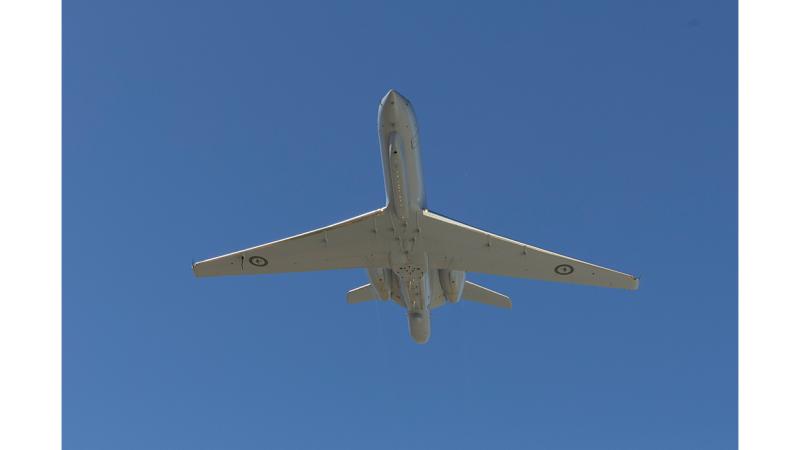 The underside of an aircraft in flight.
