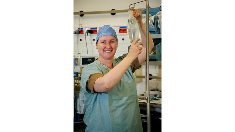 A female nurse with an IV drip.