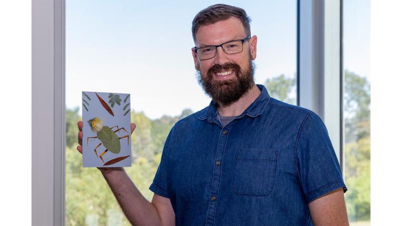 A man displays his art.