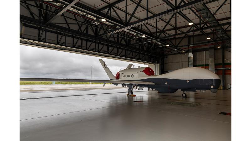 An aircraft stationed in a hangar.