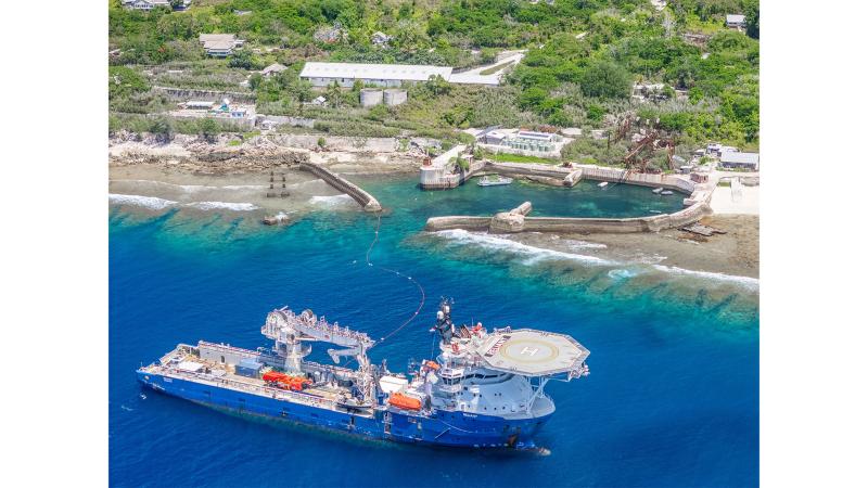 A ship stops alongside a port.