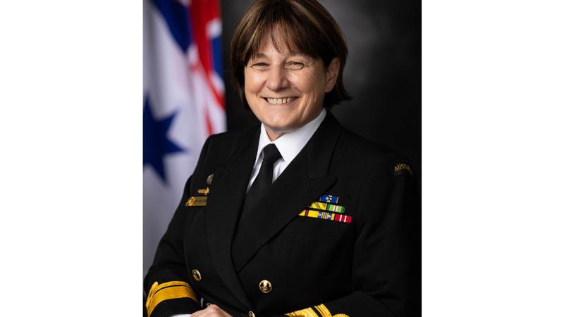 A portrait shot of a woman in Navy uniform.