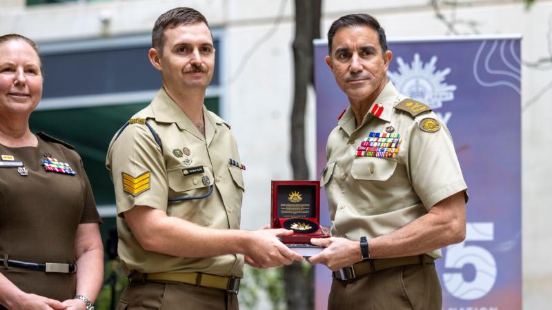 Chief of Army presents to Mathew Booth.