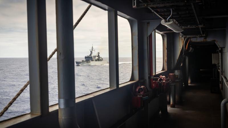 Royal Malaysian Navy ship KD Lekir approaches HMAS Choules to conduct a replenishment-at-sea approach off the Gold Coast, Queensland, during Exercise KAKADU 2026..