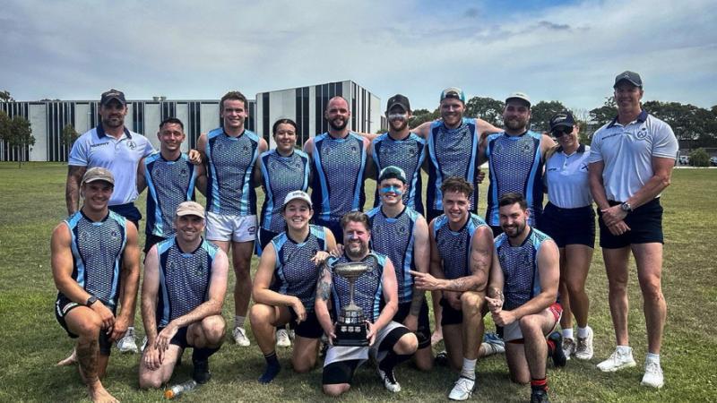 Players from HMAS Adelaide team pose with the Father MacDonald Cup after winning the competition, held at Randwick Barracks on March 4, 2026.
