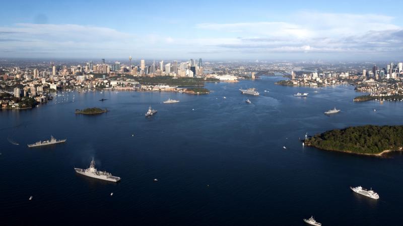 Several naval ships scattered across Sydney Harbour.