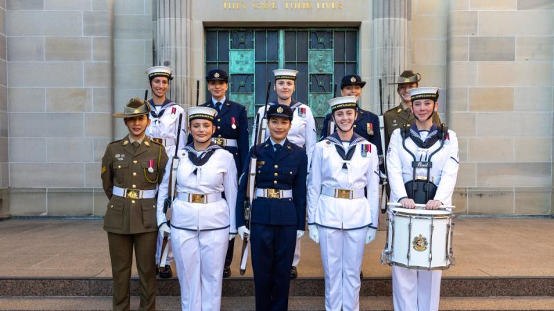 A team of Army and Navy all female Federation Guard face the camera.
