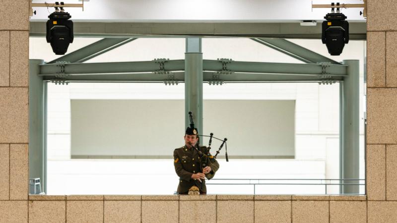 Army soldier play the bagpipes during a ceremony for Anzac Day in Korea.