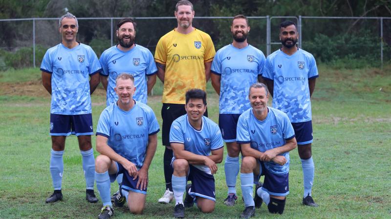 A team of male athletes in sports uniform.