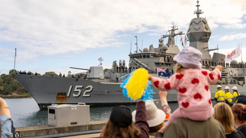 Families and friends celebrate the return of HMAS Warramunga.