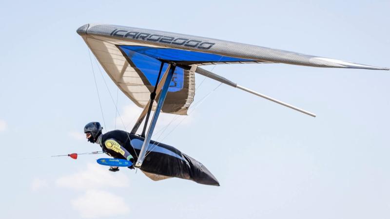 A man hang gliding in the air. 