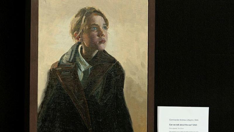 An oil painting of a young girls with a shawl is on display..