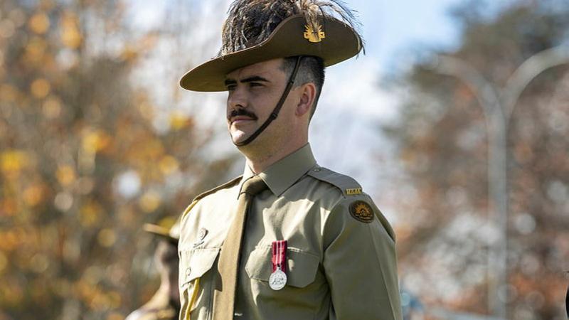 An Army officer stands at attention during a graduation parade in Canberra.