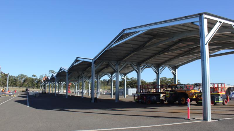  A series of bays covered with roofing to house 14 new Defence vehicles.