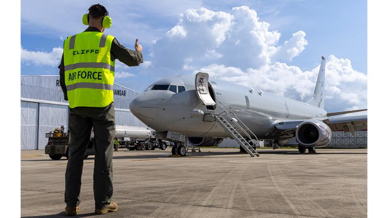 An Air Force member gives a thumbs up to a stationary email.