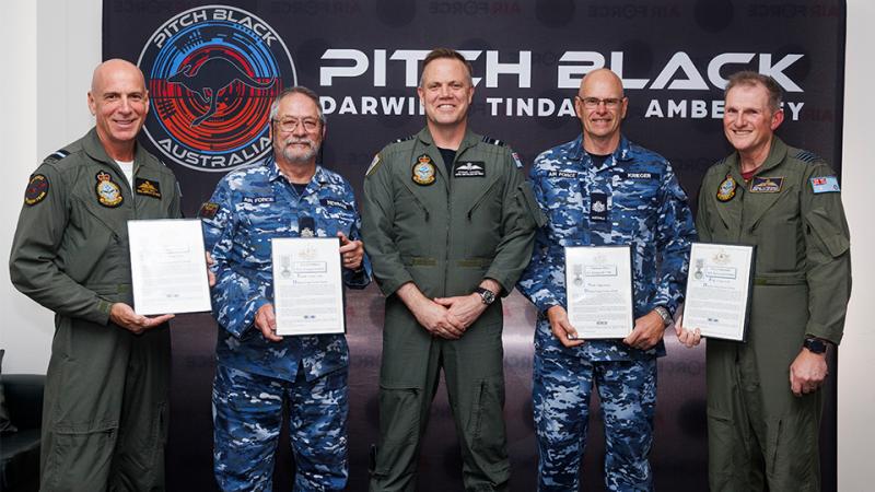 Five military men, four with awards.